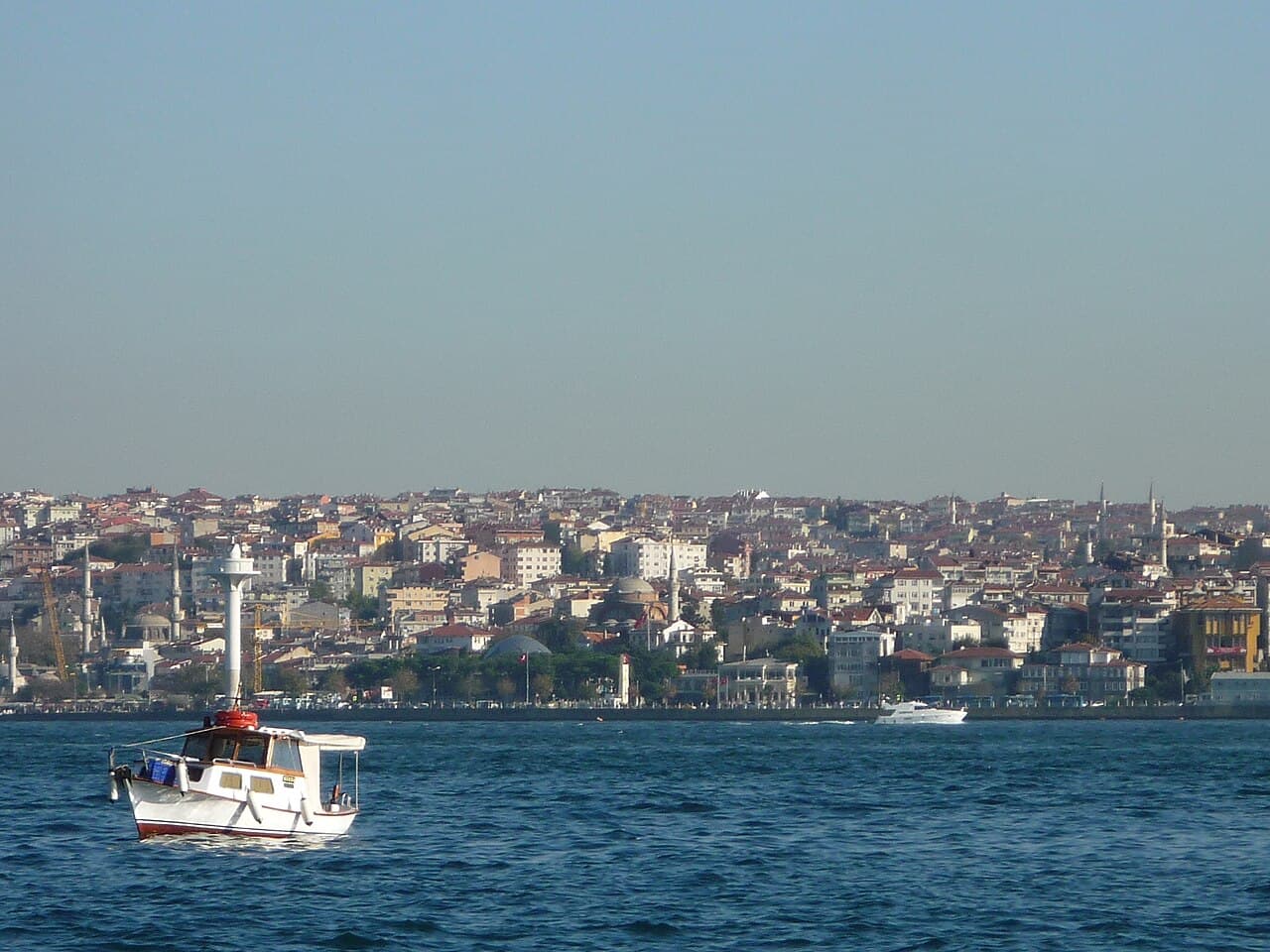 Boat on the Bosphorus off Kabatas with the Uskudar shoreline and minarets behind